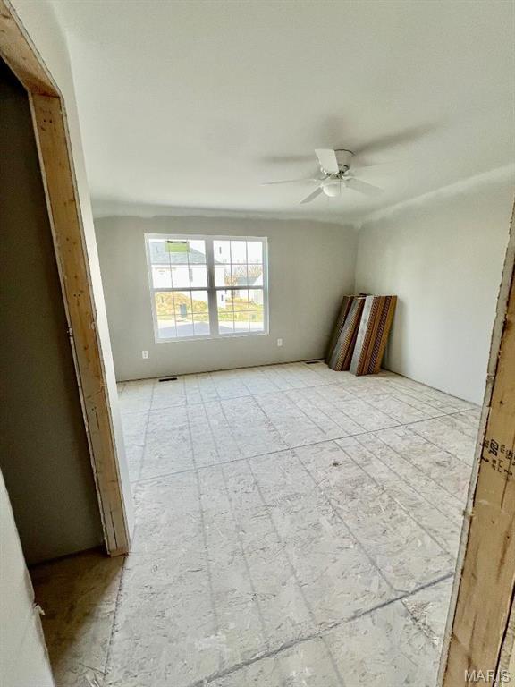 spare room featuring a ceiling fan