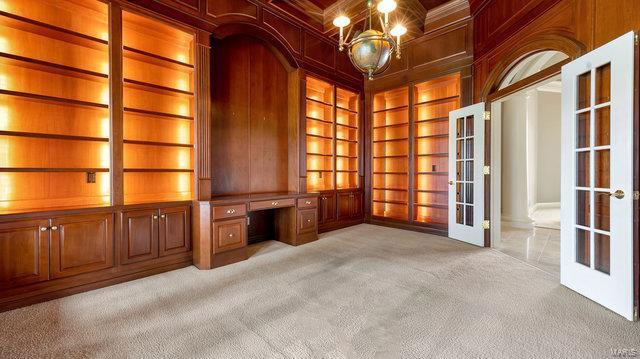 962 Hwy W, Foristell, MO 63348 - unfurnished office with french doors, built in features, carpet floors, wooden walls, and built in desk
