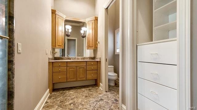 962 Hwy W, Foristell, MO 63348 - bathroom with toilet, vanity, and baseboards