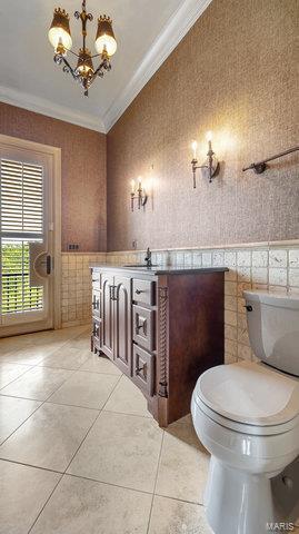 962 Hwy W, Foristell, MO 63348 - bathroom featuring ornamental molding, toilet, tile patterned floors, wallpapered walls, and a chandelier