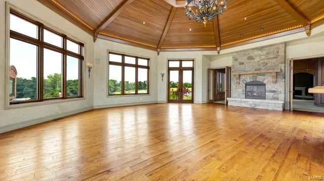 962 Hwy W, Foristell, MO 63348 - unfurnished living room with wood ceiling, hardwood / wood-style flooring, a chandelier, high vaulted ceiling, and beam ceiling