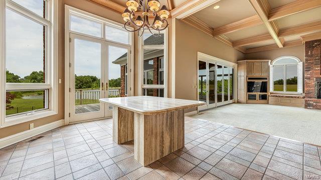 962 Hwy W, Foristell, MO 63348 - kitchen featuring a chandelier, beam ceiling, coffered ceiling, baseboards, and crown molding