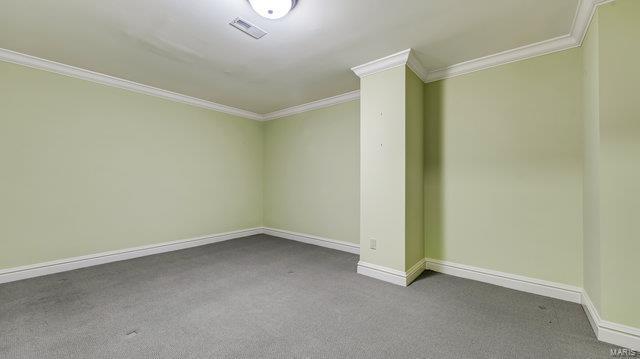 962 Hwy W, Foristell, MO 63348 - empty room with ornamental molding, dark carpet, and baseboards