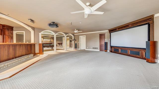 962 Hwy W, Foristell, MO 63348 - home theater featuring carpet, a ceiling fan, and ornamental molding