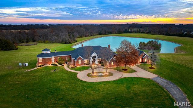 962 Hwy W, Foristell, MO 63348 - aerial view at dusk of a water view