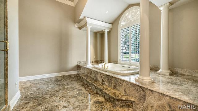962 Hwy W, Foristell, MO 63348 - bathroom with a bath, decorative columns, ornamental molding, and lofted ceiling