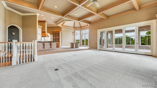 962 Hwy W, Foristell, MO 63348 - spare room with coffered ceiling, crown molding, beam ceiling, carpet floors, and ceiling fan