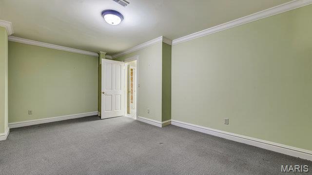 962 Hwy W, Foristell, MO 63348 - unfurnished room with ornamental molding and carpet floors