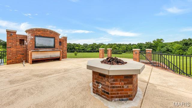 962 Hwy W, Foristell, MO 63348 - view of patio / terrace featuring a fire pit