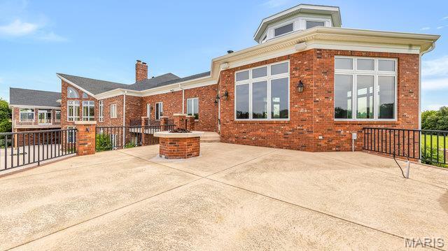 962 Hwy W, Foristell, MO 63348 - view of patio / terrace with an outdoor fire pit