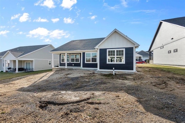 2224 Heywood Mdws, Cape Girardeau, MO 63701 - rear view of house with board and batten siding and covered porch