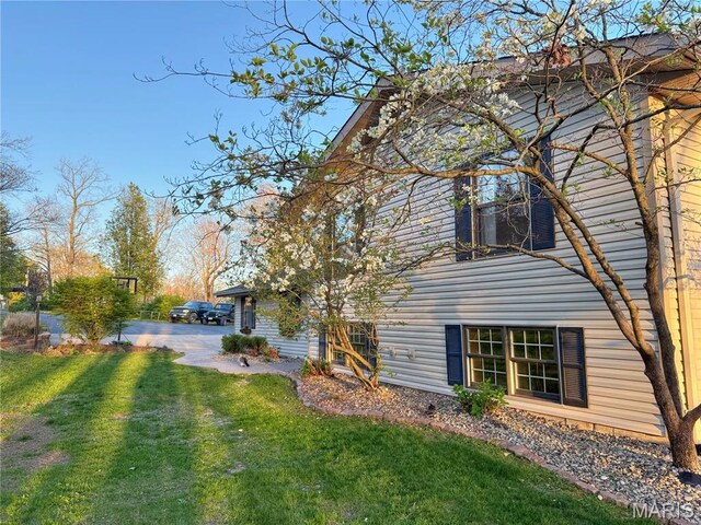 rear view of house with a lawn