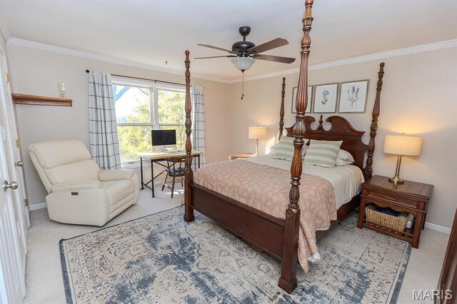 bedroom with crown molding, an office area, baseboards, and carpet flooring