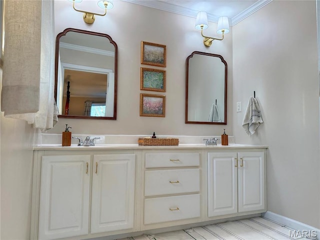 bathroom featuring crown molding, double vanity, and baseboards