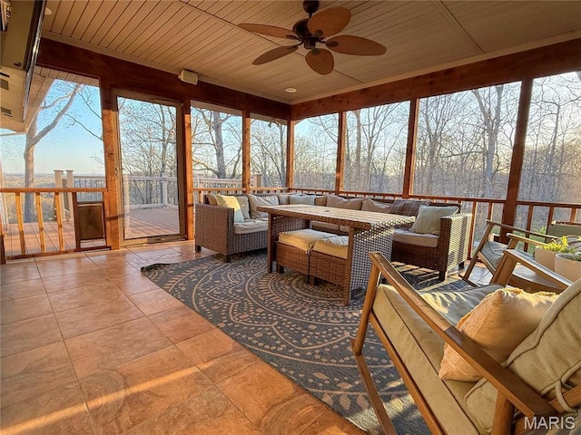 sunroom / solarium featuring wooden ceiling and tile patterned flooring