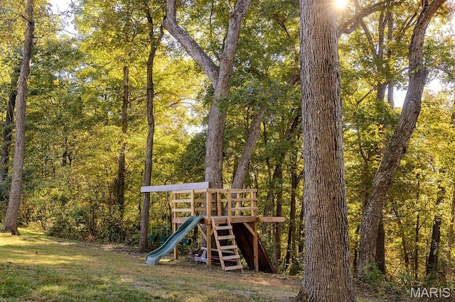 view of playground featuring a view of trees