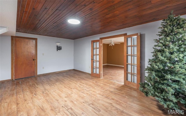 22125 Teak Ln, Saint Robert, MO 65584 - spare room with french doors, wood finished floors, baseboards, and wooden ceiling