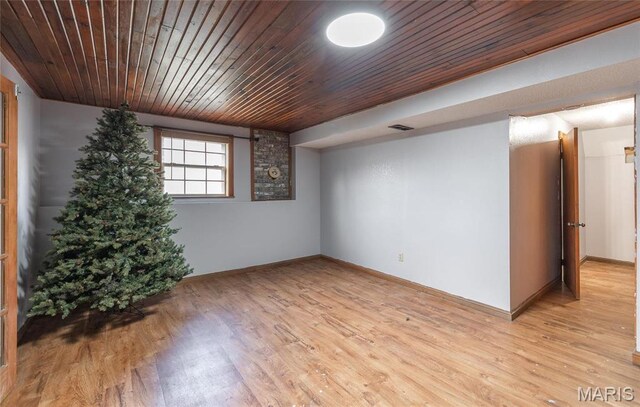 22125 Teak Ln, Saint Robert, MO 65584 - spare room with baseboards, light wood-style flooring, and wooden ceiling