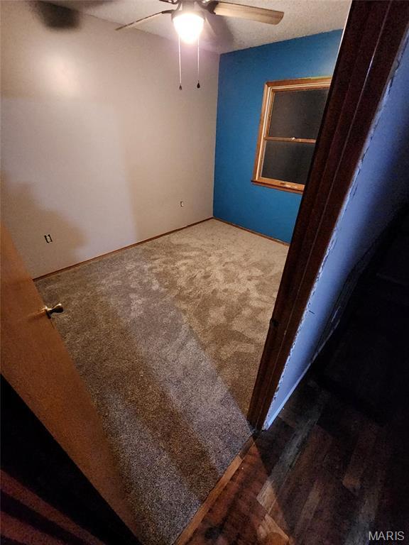 22125 Teak Ln, Saint Robert, MO 65584 - carpeted spare room featuring a ceiling fan