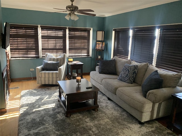 1856 E Broadway, Alton, IL 62002 - living area with ceiling fan, wood finished floors, baseboards, and crown molding