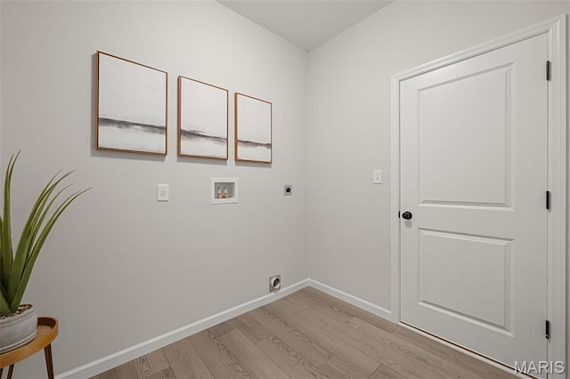 511 Kit Fox Ct, Eureka, MO 63025 - clothes washing area with electric dryer hookup, light wood-style flooring, hookup for a washing machine, and baseboards