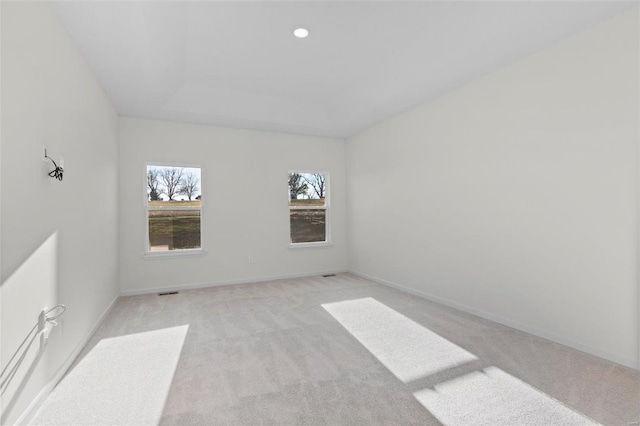 122 Harrow Dr, Ofallon, MO 63385 - empty room featuring light colored carpet, baseboards, and recessed lighting