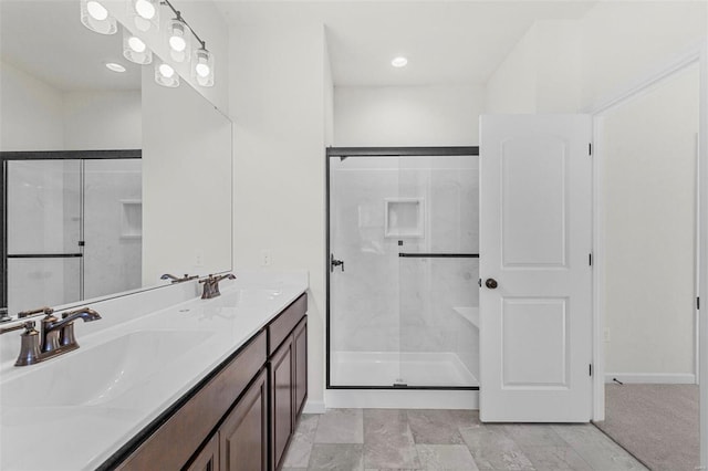 122 Harrow Dr, Ofallon, MO 63385 - full bath featuring a stall shower, baseboards, and double vanity