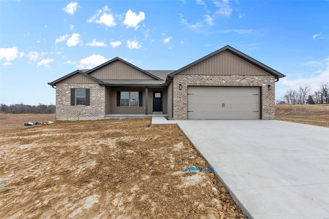 358 Byrd Ct, Jackson, MO 63755 - view of front of home with brick siding, an attached garage, and concrete driveway