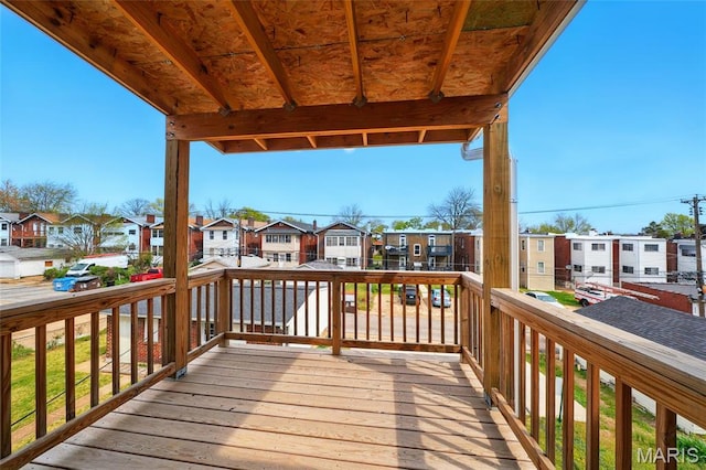 wooden deck with a residential view
