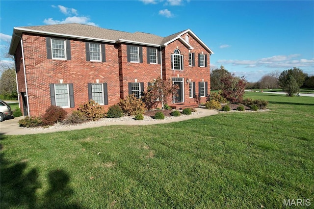 334 Spring Lake Rd, Millstadt, IL 62260 - colonial house with a front yard and brick siding