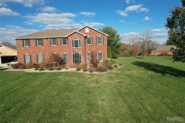 334 Spring Lake Rd, Millstadt, IL 62260 - colonial house with a front yard and brick siding