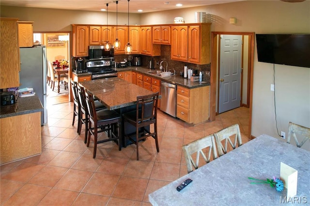 334 Spring Lake Rd, Millstadt, IL 62260 - kitchen featuring stainless steel appliances, a sink, light tile patterned floors, decorative backsplash, and recessed lighting