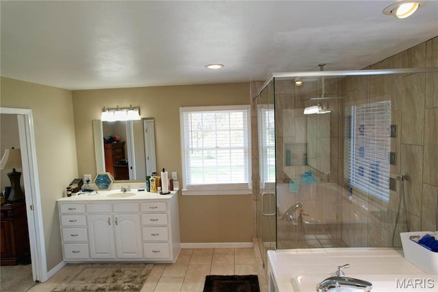 334 Spring Lake Rd, Millstadt, IL 62260 - full bathroom with vanity, tile patterned flooring, baseboards, a stall shower, and a garden tub