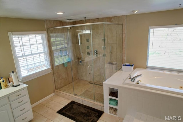 334 Spring Lake Rd, Millstadt, IL 62260 - bathroom featuring healthy amount of natural light, tile patterned flooring, a whirlpool tub, and a stall shower