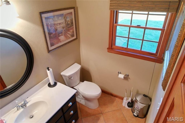334 Spring Lake Rd, Millstadt, IL 62260 - half bathroom featuring toilet, vanity, tile patterned flooring, and baseboards