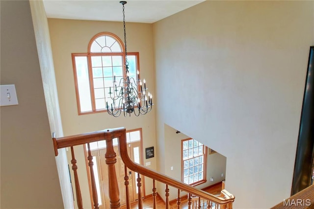 334 Spring Lake Rd, Millstadt, IL 62260 - stairs featuring a chandelier and a towering ceiling