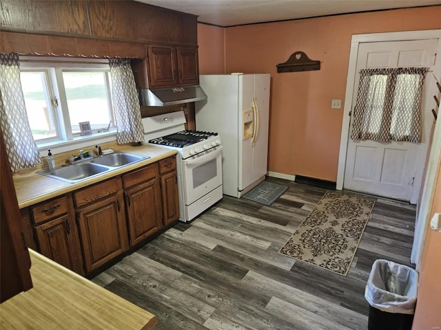 174 Clinton St, Hamburg, IL 62045 - kitchen featuring white appliances, a sink, under cabinet range hood, dark wood-style flooring, and light countertops