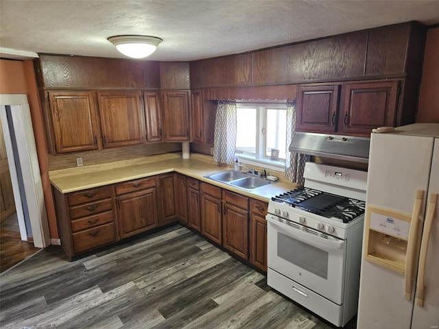 174 Clinton St, Hamburg, IL 62045 - kitchen featuring white appliances, under cabinet range hood, a sink, a textured ceiling, and light countertops