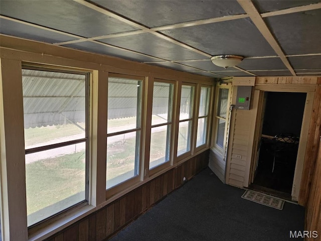 174 Clinton St, Hamburg, IL 62045 - unfurnished sunroom with carpet, wood walls, and electric panel