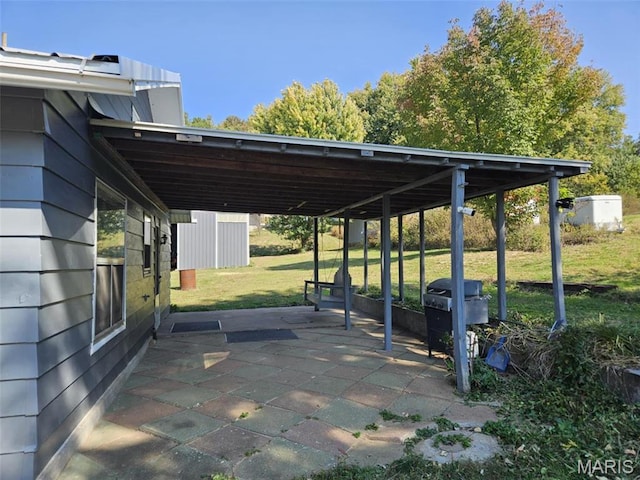 174 Clinton St, Hamburg, IL 62045 - view of parking featuring a carport