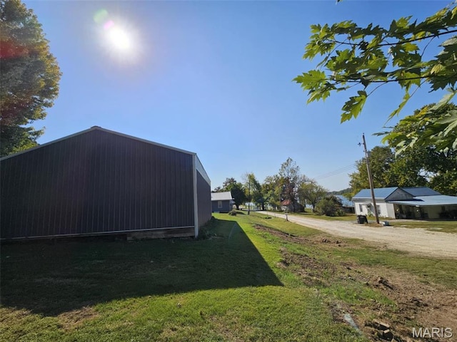 174 Clinton St, Hamburg, IL 62045 - view of green lawn with dirt driveway and an outbuilding