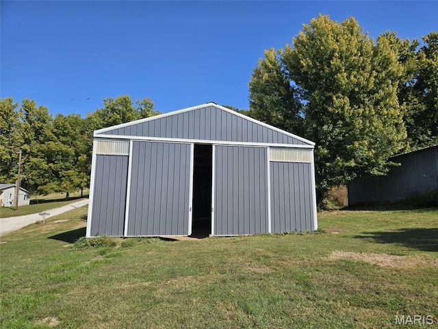 174 Clinton St, Hamburg, IL 62045 - view of pole building with a lawn