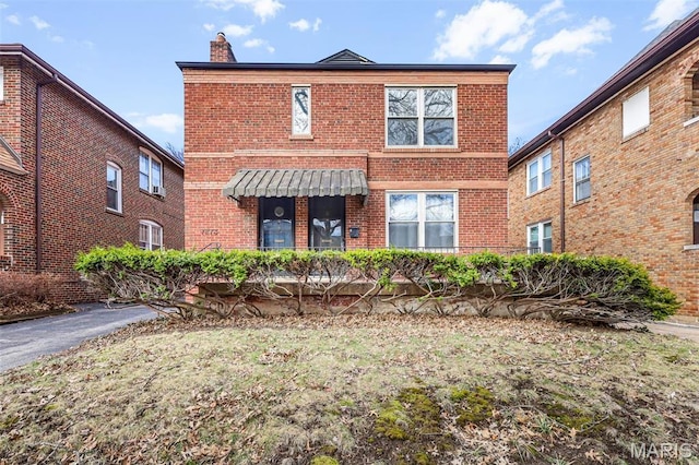 7273 Dartmouth Ave, Saint Louis, MO 63130 - view of front of property featuring brick siding and a chimney