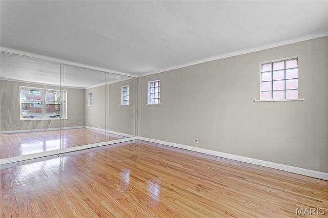 7273 Dartmouth Ave, Saint Louis, MO 63130 - unfurnished bedroom with baseboards, wood finished floors, and ornamental molding