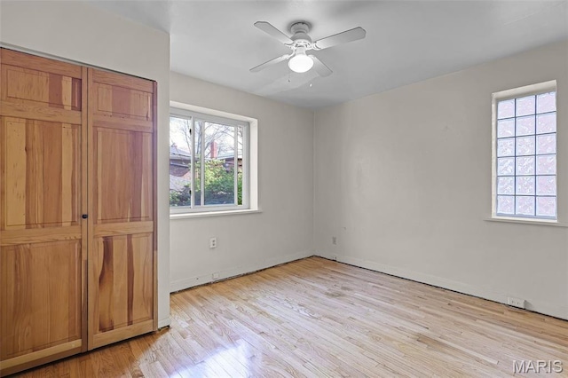 7273 Dartmouth Ave, Saint Louis, MO 63130 - unfurnished bedroom featuring light wood-style floors, baseboards, and ceiling fan