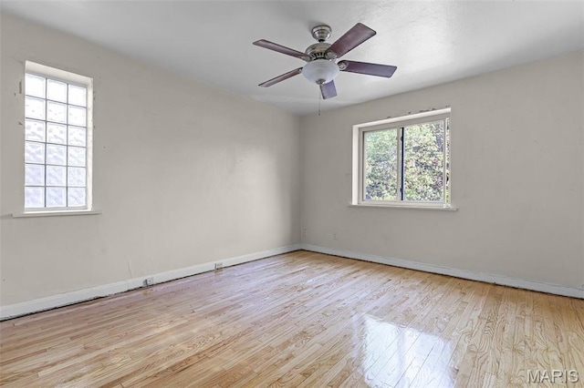 7273 Dartmouth Ave, Saint Louis, MO 63130 - spare room featuring wood finished floors, baseboards, and ceiling fan
