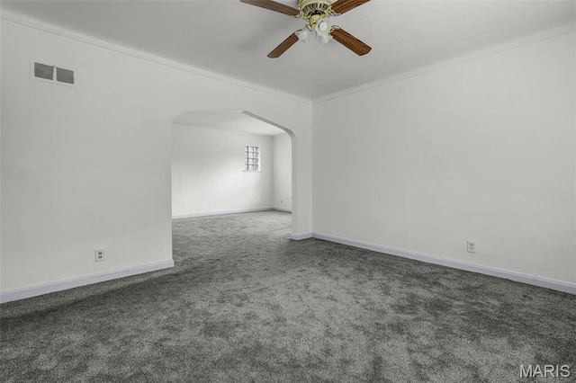 7273 Dartmouth Ave, Saint Louis, MO 63130 - carpeted empty room featuring ceiling fan, arched walkways, and baseboards