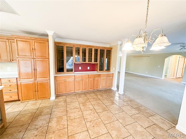 663 County Road 2590, Salem, MO 65462 - kitchen featuring ornamental molding, light countertops, a chandelier, arched walkways, and glass insert cabinets
