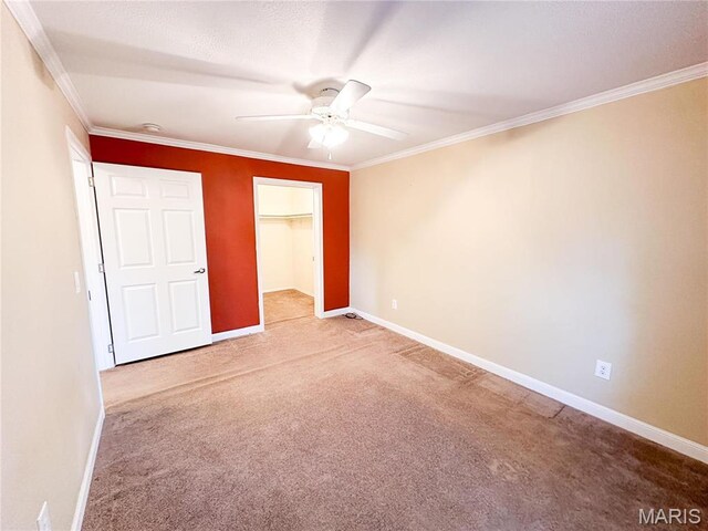 663 County Road 2590, Salem, MO 65462 - unfurnished bedroom featuring carpet, ornamental molding, a closet, and a ceiling fan