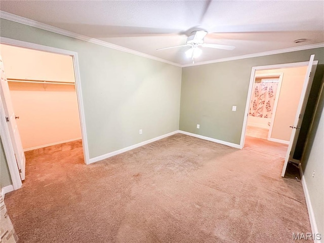 663 County Road 2590, Salem, MO 65462 - unfurnished bedroom with a spacious closet, carpet flooring, ornamental molding, a closet, and ceiling fan